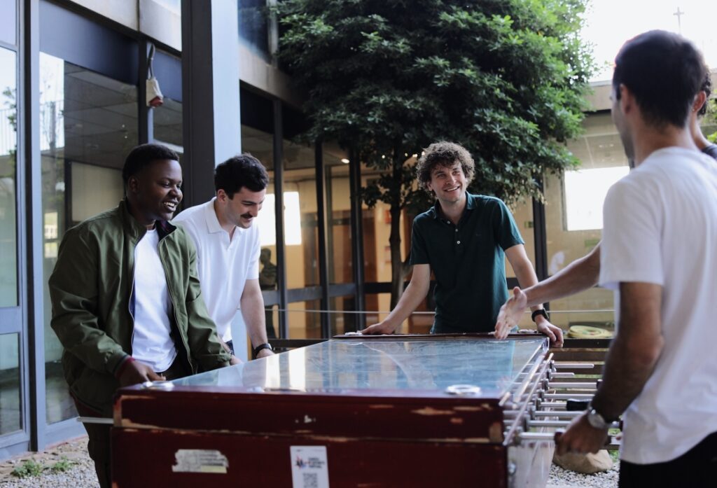 Group of students playing table football together