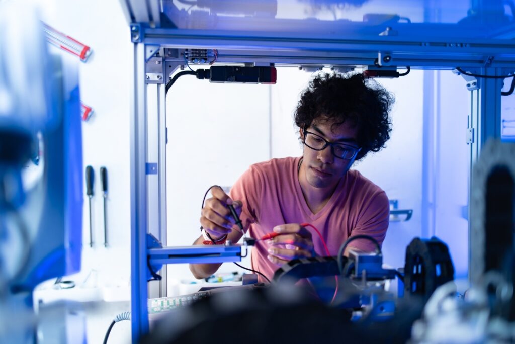 Student working with engineering equipment in a laboratory