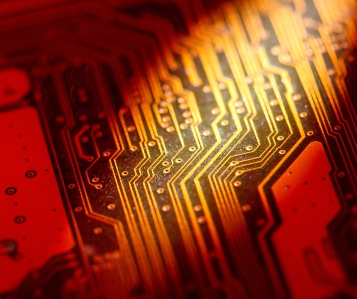 Close-up of an electronic circuit board with illuminated components