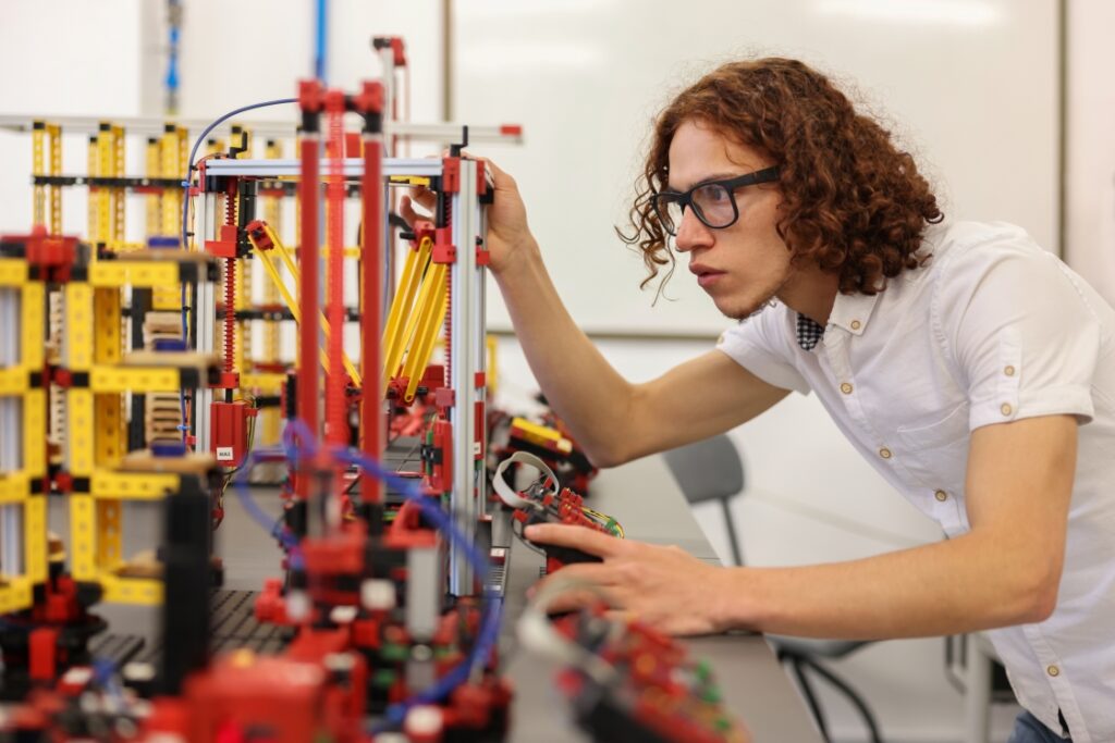 Student working with technical equipment in an engineering laboratory